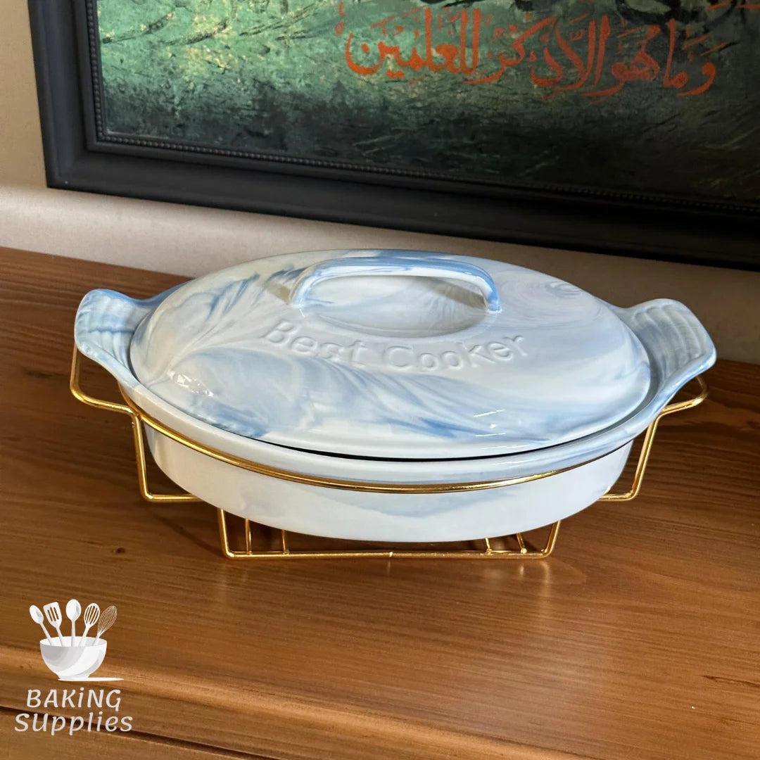 Marble-patterned ceramic dish with gold handles.