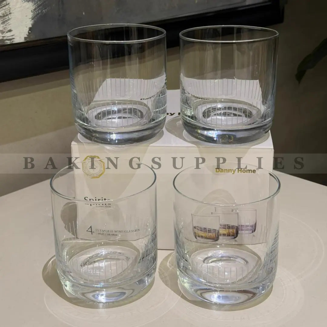 Four clear glass tumblers
