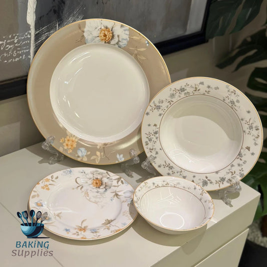 Set of ceramic plates and bowls with floral patterns .