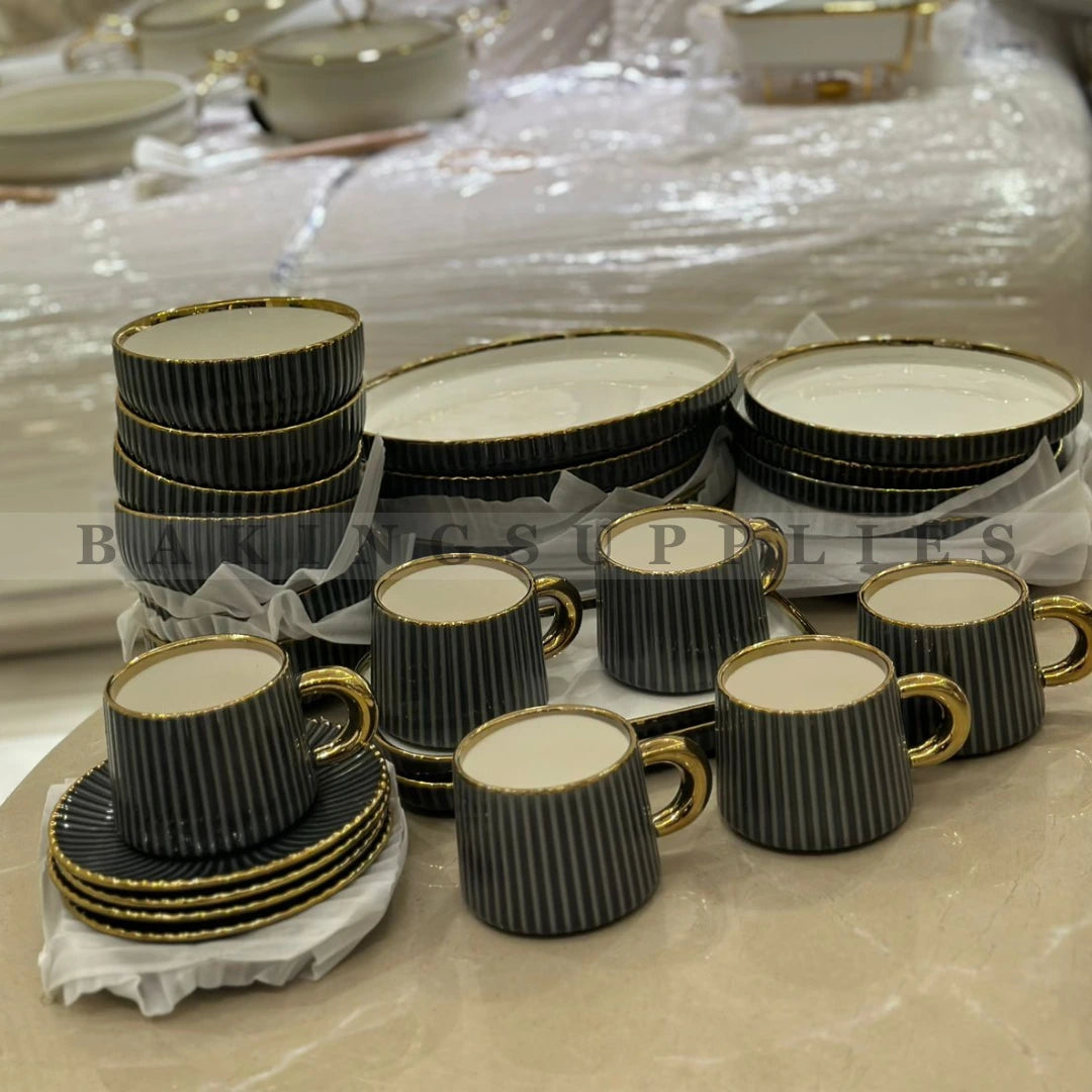 Set of black and gold ceramic cups and saucers
