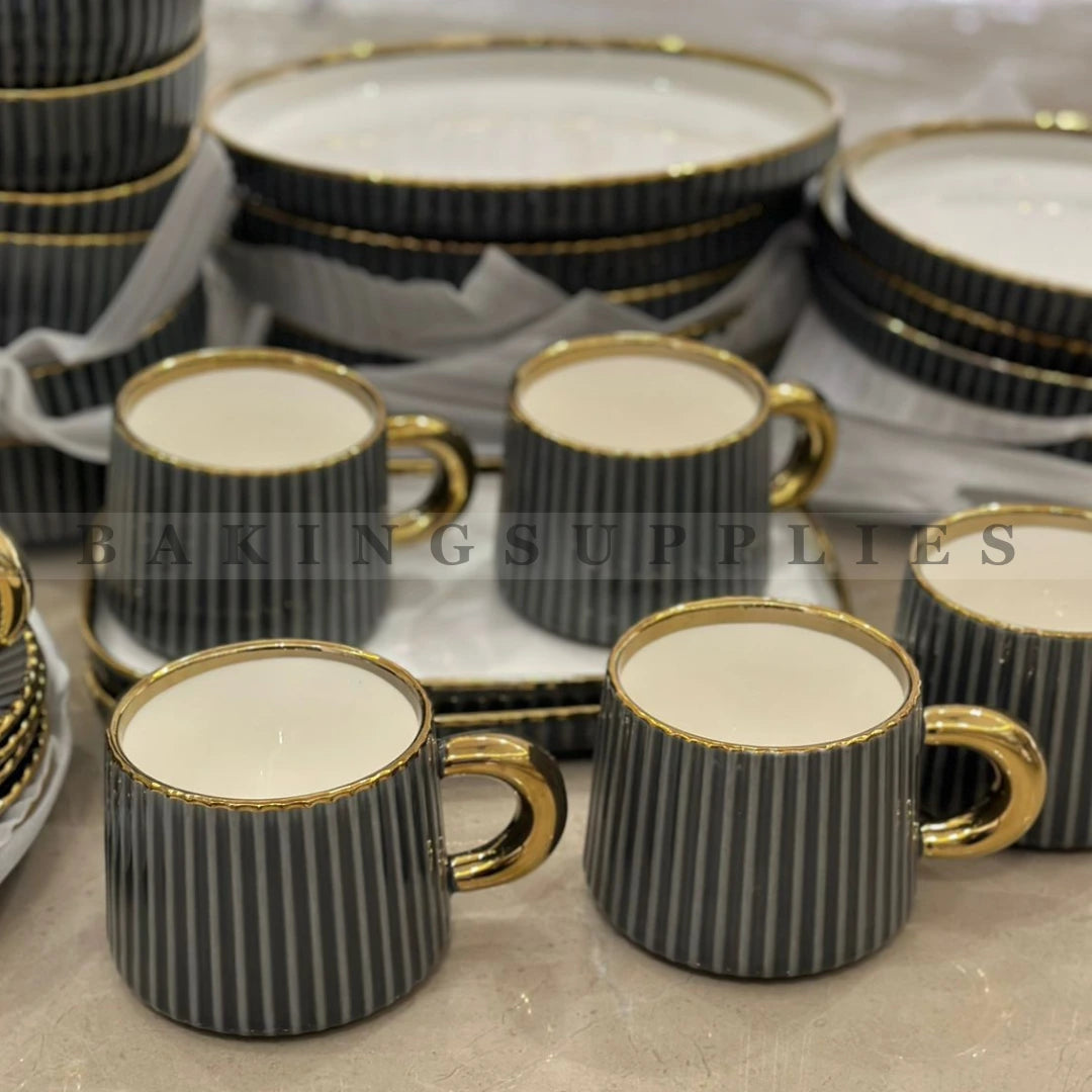 Set of black and gold striped ceramic mugs 