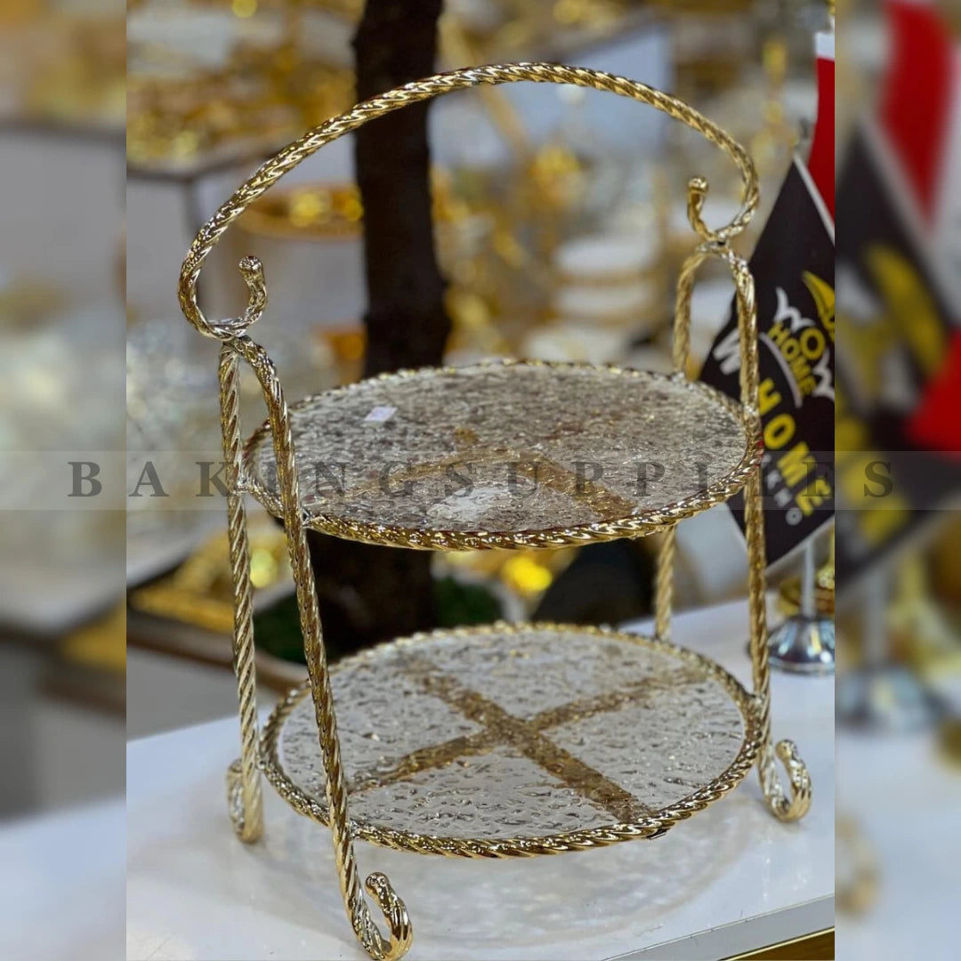 Gold two-tiered stand with decorative plates 