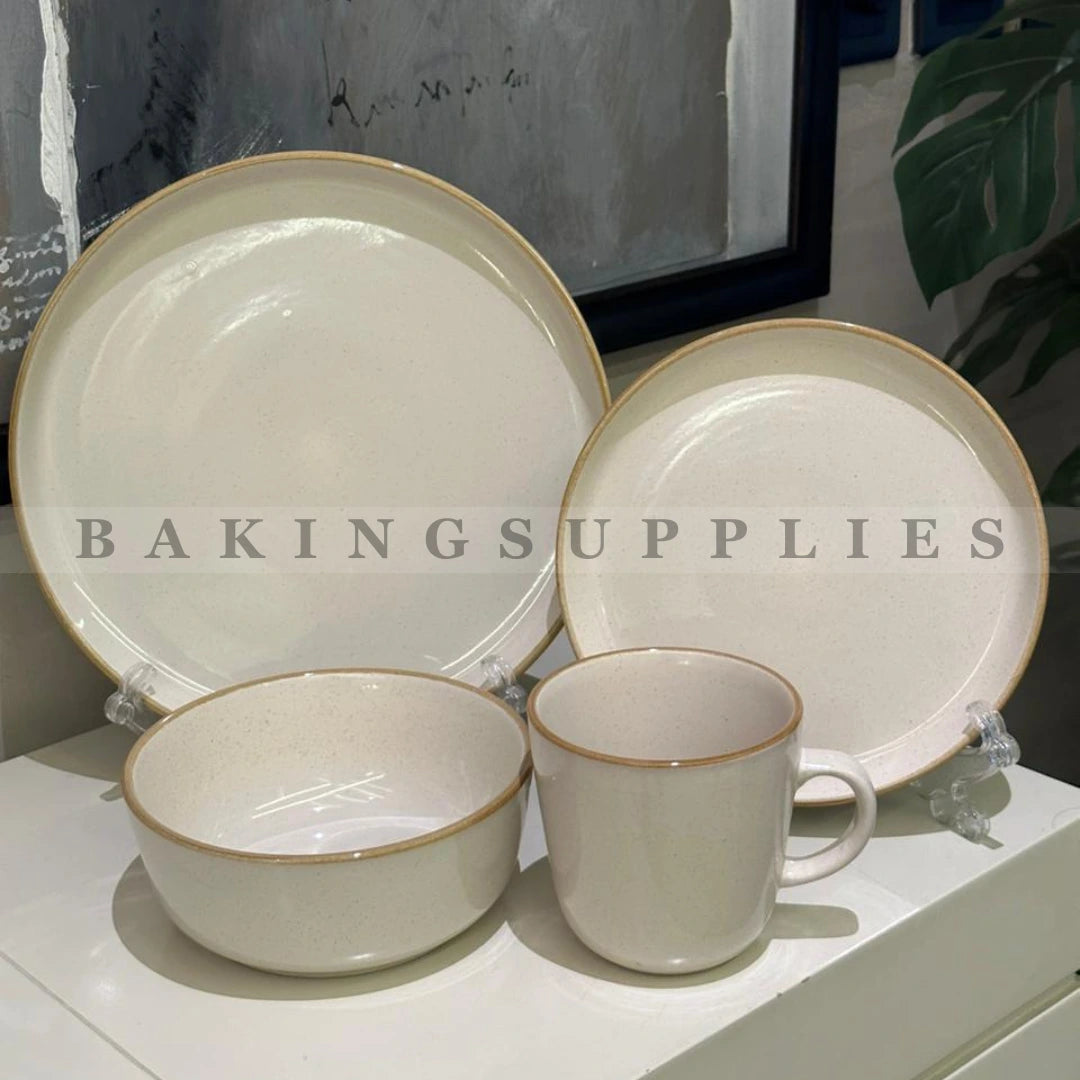 Ceramic dinnerware set with beige and gold trim