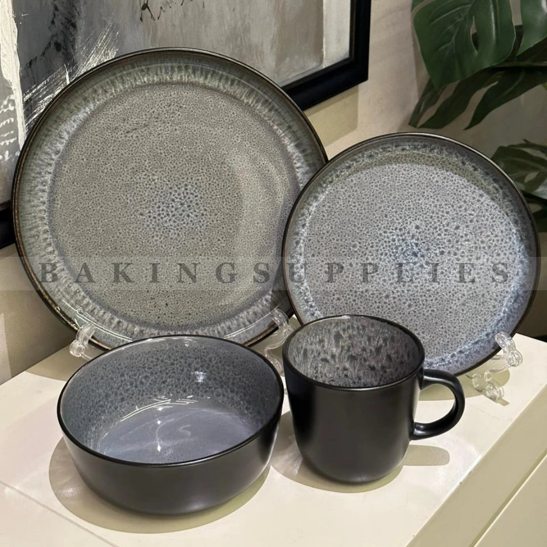Set of gray ceramic plates, black bowl, and mug 
