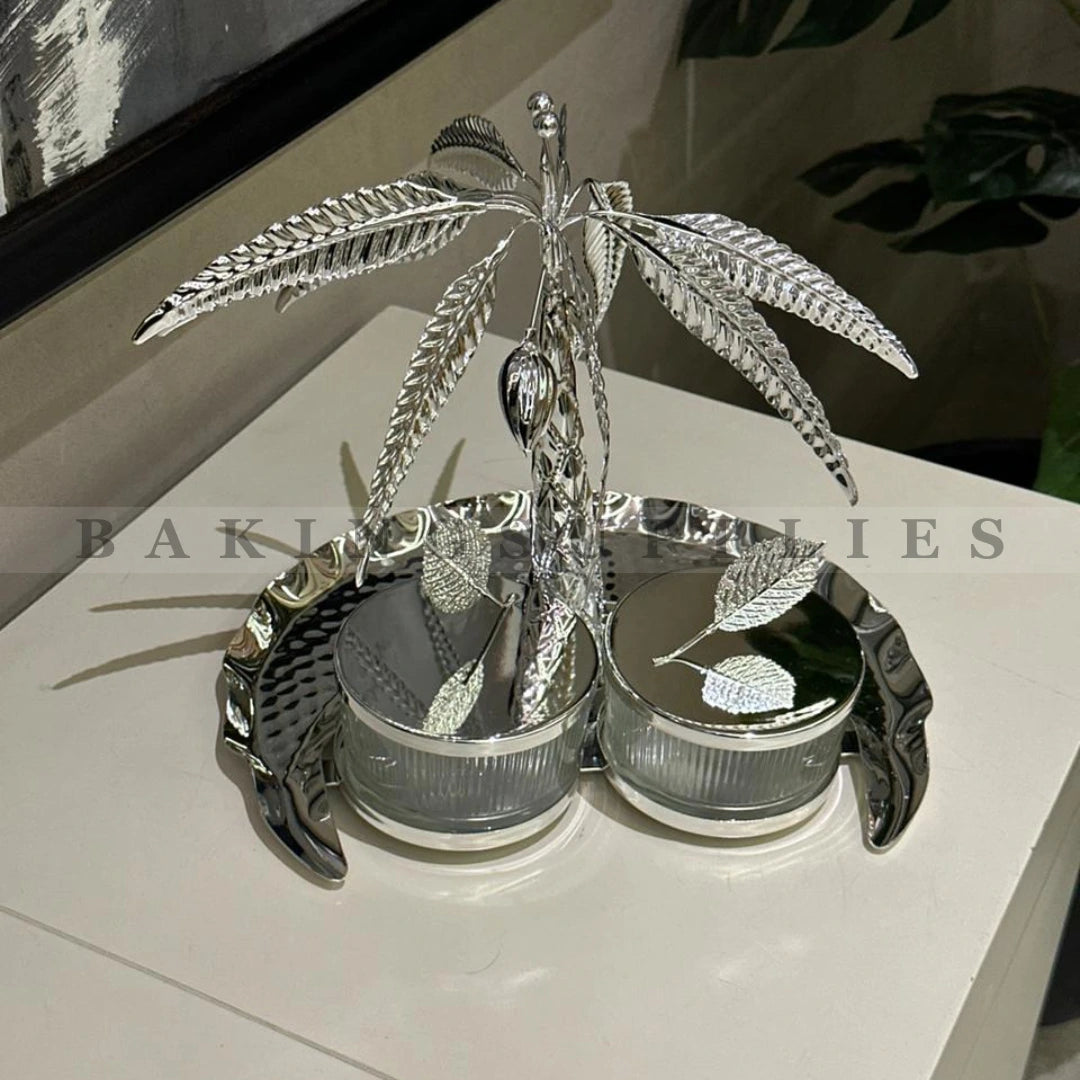 Silver palm tree-shaped object branding.