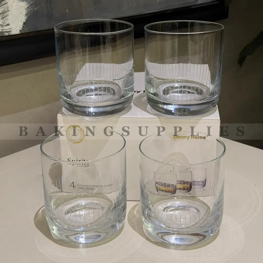 Four clear glass tumblers 