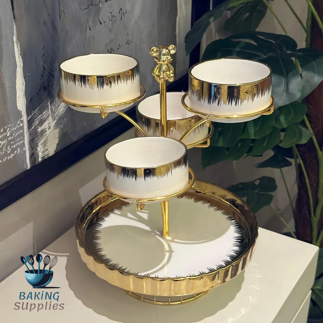 Three-tiered gold and white cake stand 